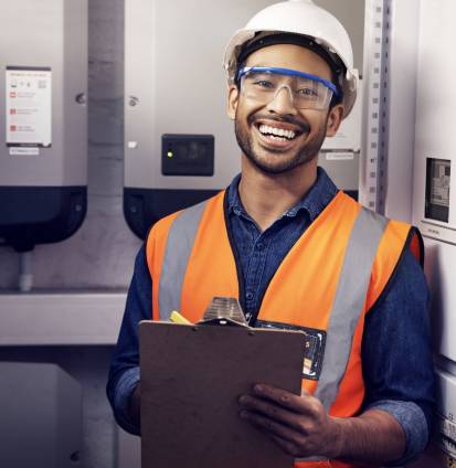 Portrait of happy man, engineering and technician at control panel, inspection and maintenance plan.